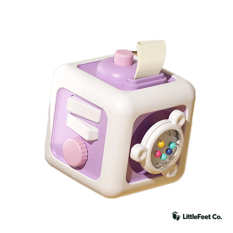 6-in-1 Montessori Activity Cube in purple with LittleFeet Co. logo